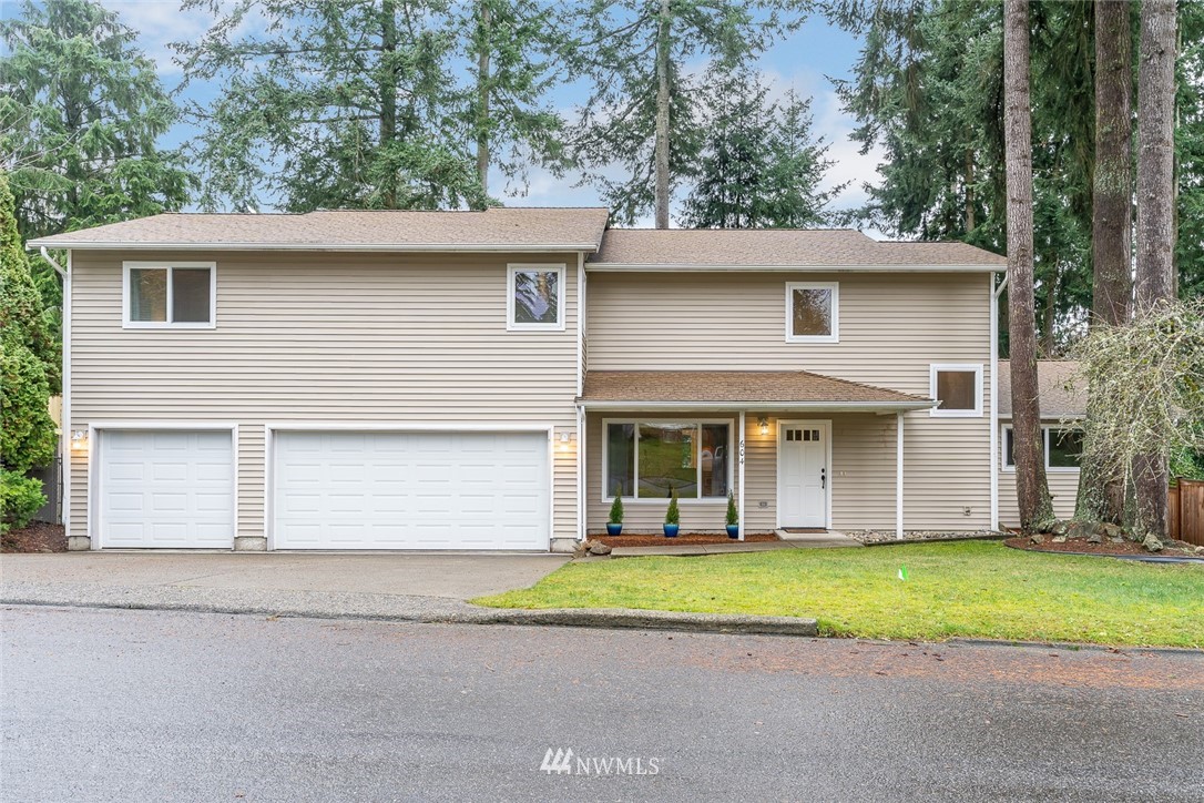 604 216th Street Southwest Bothell, WA 98021 - Photo 1 of 33 a view of a house with a yard plants and large tree
