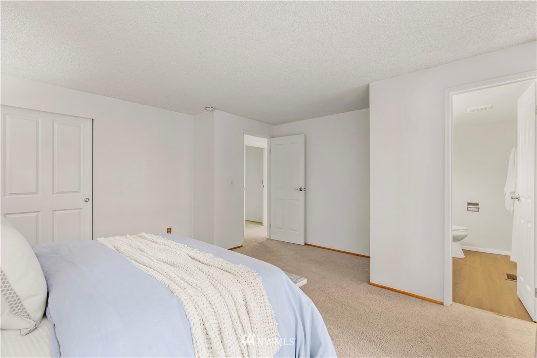 604 216th Street Southwest Bothell, WA 98021 - Photo 13 of 33 a bedroom with a bed and a cabinets