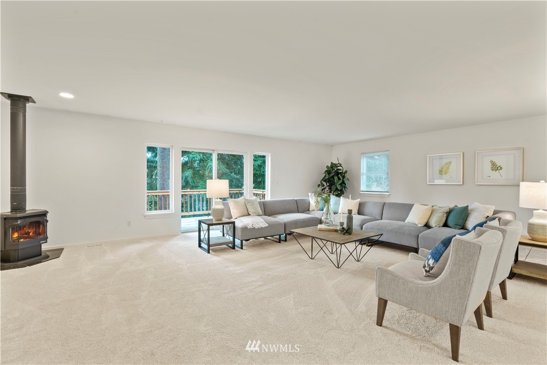 604 216th Street Southwest Bothell, WA 98021 - Photo 19 of 33 a living room with furniture and a window