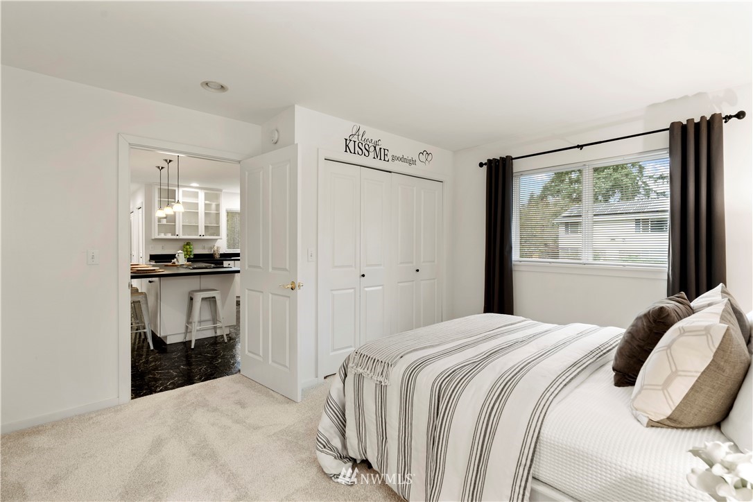 604 216th Street Southwest Bothell, WA 98021 - Photo 26 of 33 a bedroom with a bed and a window