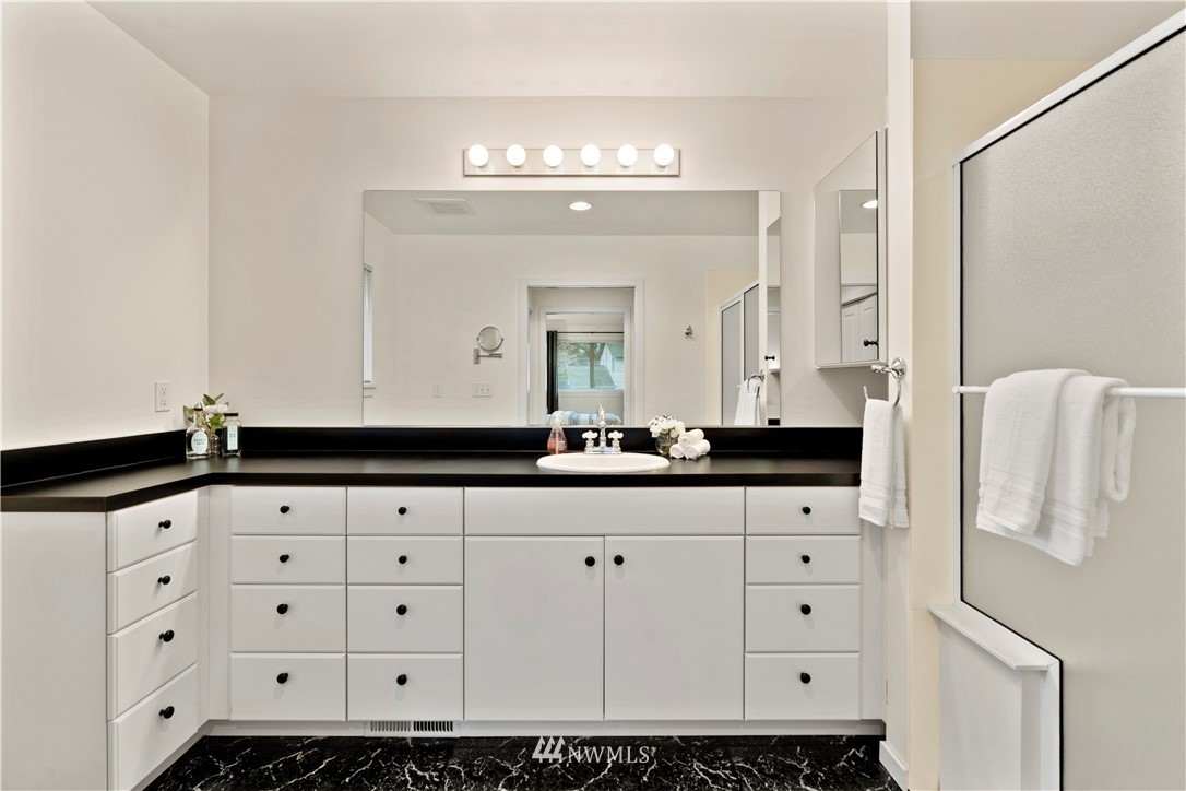 604 216th Street Southwest Bothell, WA 98021 - Photo 28 of 33 a bathroom with a sink and a mirror