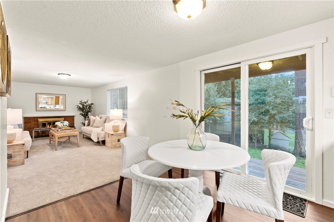 604 216th Street Southwest Bothell, WA 98021 - Photo 5 of 33 a living room with furniture and a window
