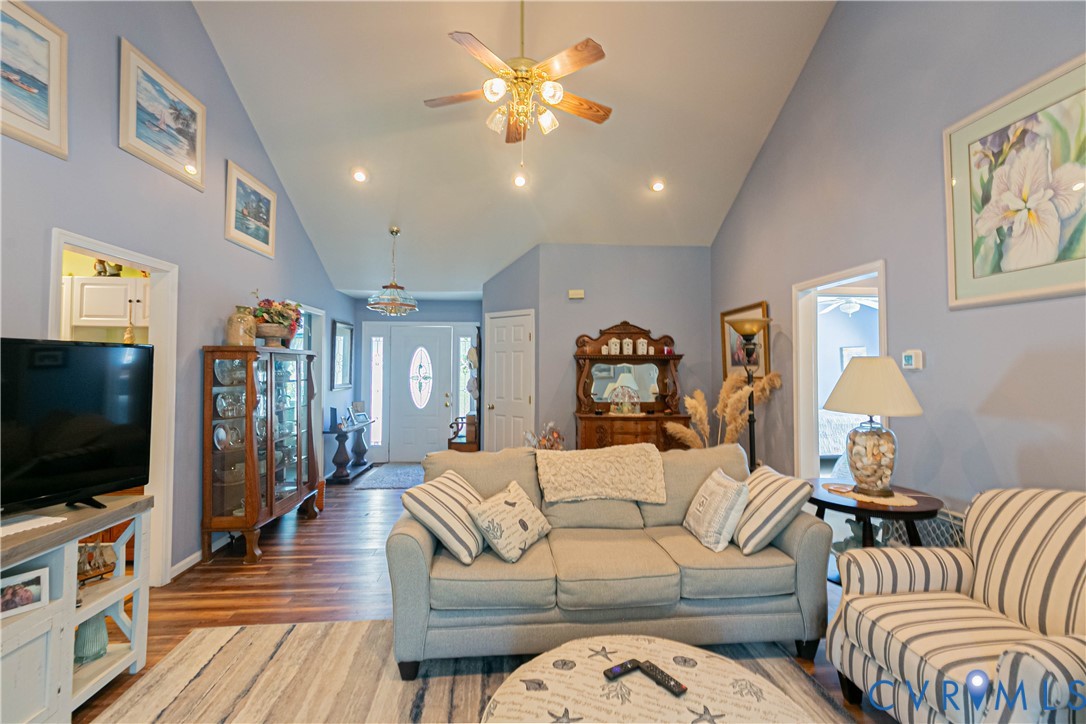 401 Loyalist Drive Ruther Glen, VA 22546 - Photo 12 of 44 a living room with furniture and a flat screen tv