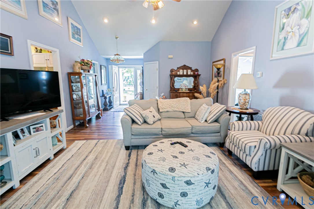 401 Loyalist Drive Ruther Glen, VA 22546 - Photo 12 of 45 a living room with furniture a flat screen tv and wooden floor