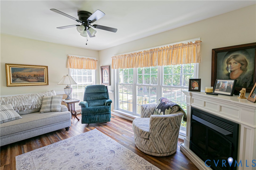 401 Loyalist Drive Ruther Glen, VA 22546 - Photo 20 of 45 a living room with furniture and a fireplace
