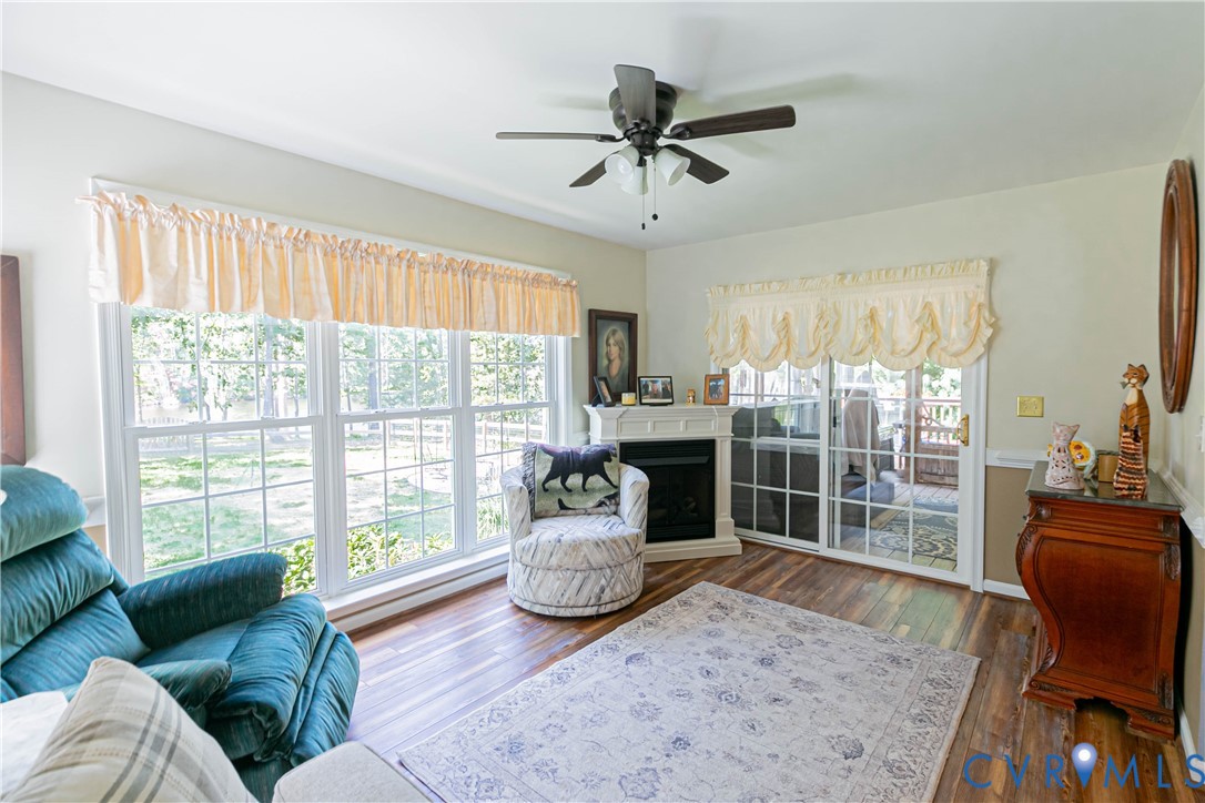401 Loyalist Drive Ruther Glen, VA 22546 - Photo 22 of 45 a living room with furniture and a large window