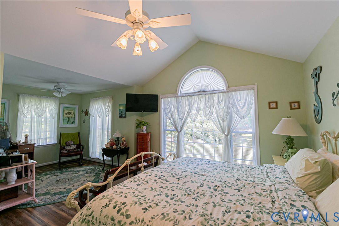 401 Loyalist Drive Ruther Glen, VA 22546 - Photo 24 of 45 a bedroom with a bed and a chandelier