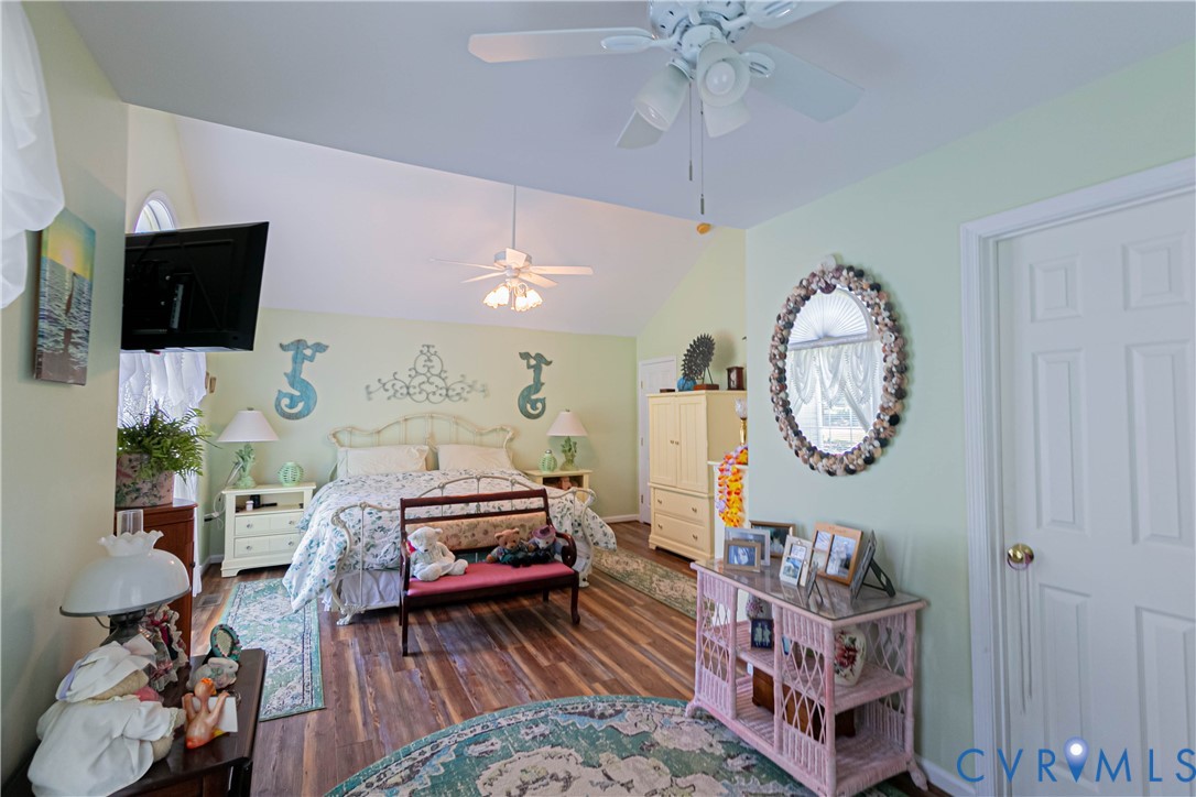 401 Loyalist Drive Ruther Glen, VA 22546 - Photo 26 of 45 a living room with furniture a flat screen tv and a window