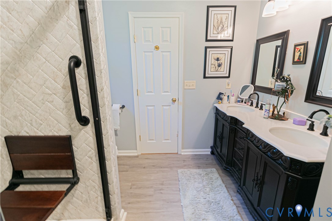 401 Loyalist Drive Ruther Glen, VA 22546 - Photo 27 of 45 a bathroom with double vanity and two mirrors