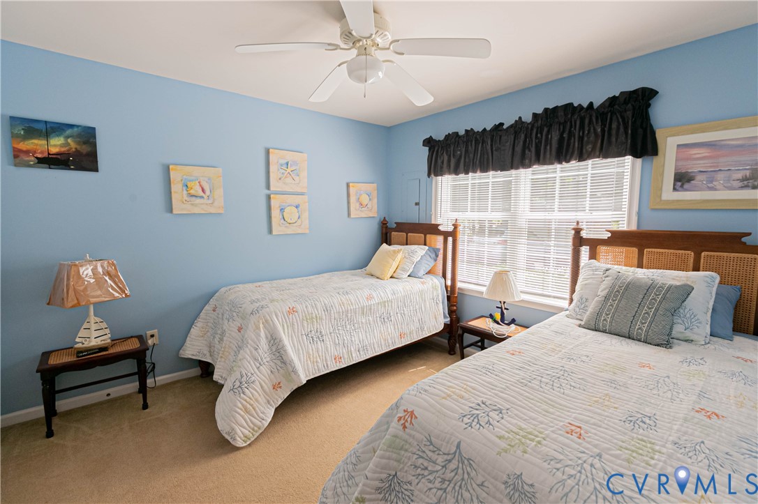 401 Loyalist Drive Ruther Glen, VA 22546 - Photo 30 of 45 a bedroom with two beds and painting on the wall