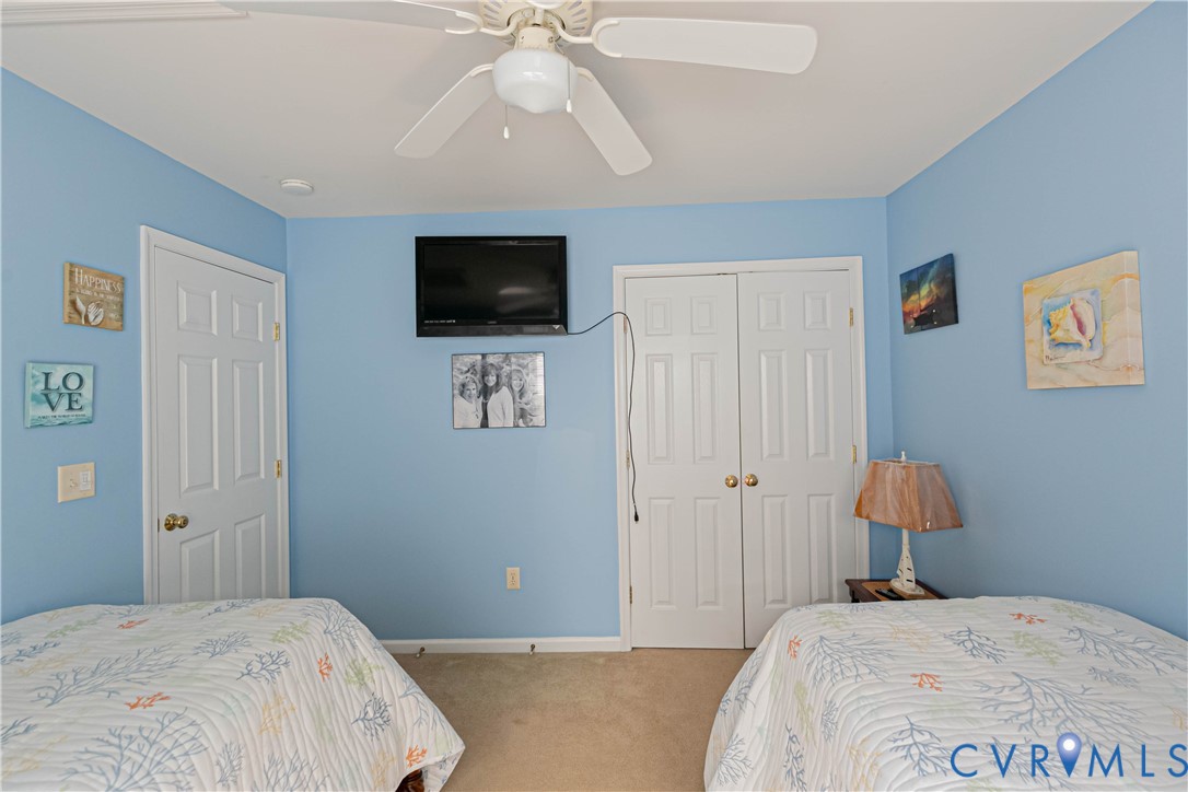 401 Loyalist Drive Ruther Glen, VA 22546 - Photo 31 of 45 a bedroom with a bed and a flat screen tv