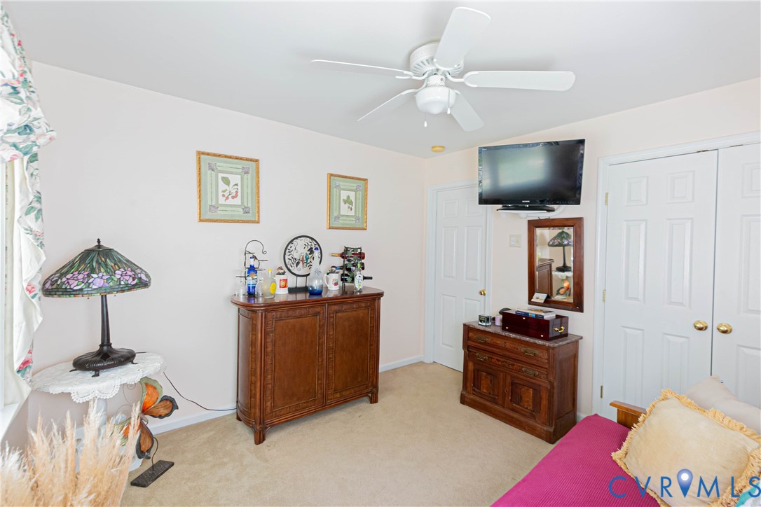 401 Loyalist Drive Ruther Glen, VA 22546 - Photo 36 of 45 a living room with furniture and a flat screen tv