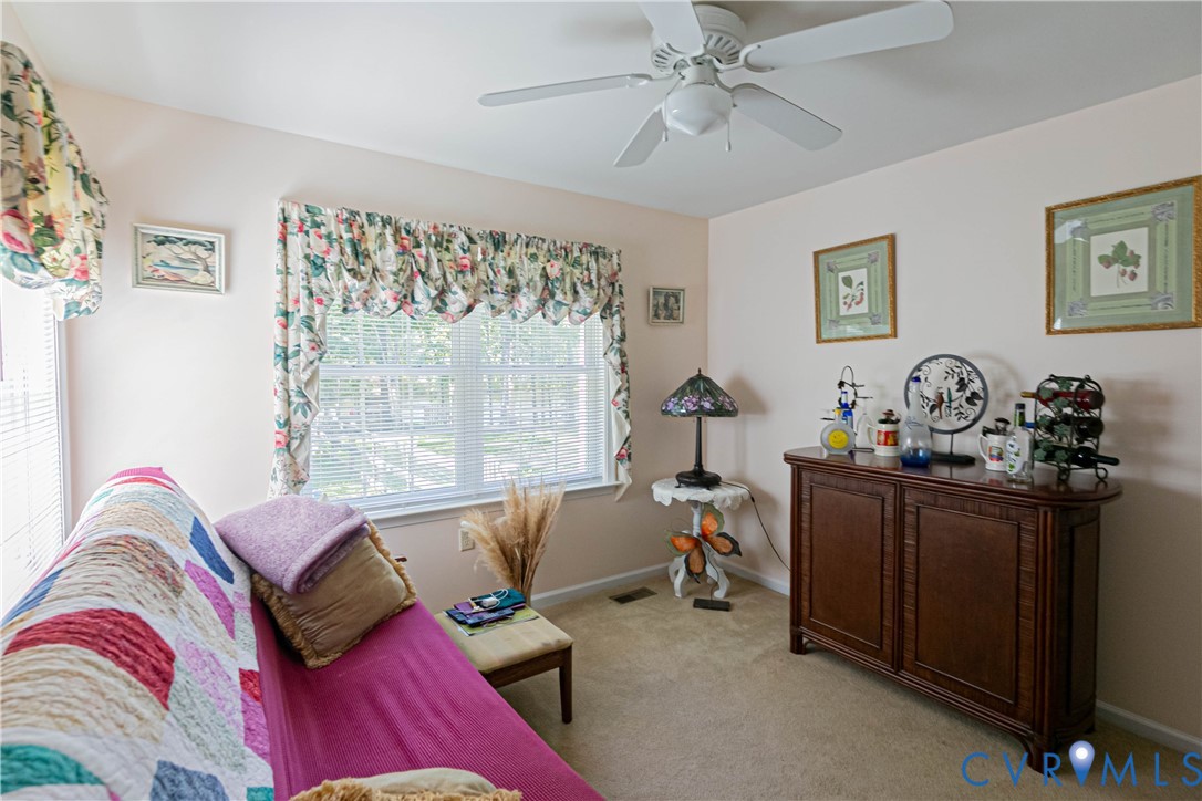 401 Loyalist Drive Ruther Glen, VA 22546 - Photo 37 of 45 a living room with furniture and a window