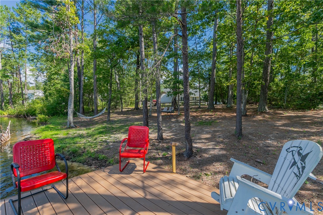 401 Loyalist Drive Ruther Glen, VA 22546 - Photo 42 of 45 a view of a bench in a garden