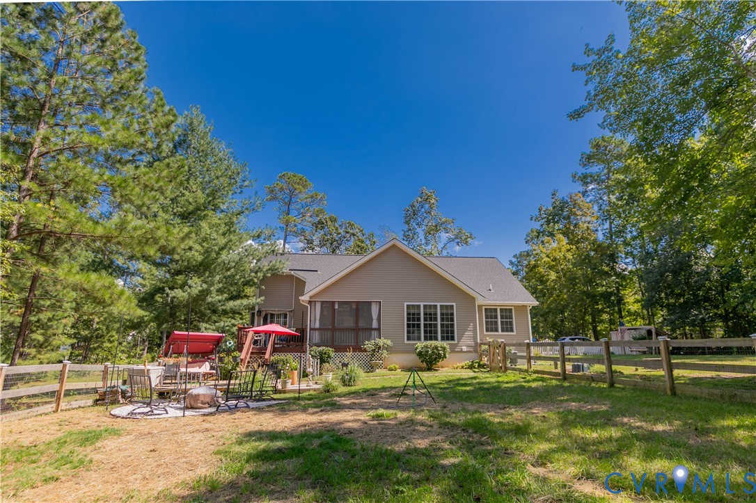 401 Loyalist Drive Ruther Glen, VA 22546 - Photo 44 of 44 a front view of a house with a yard
