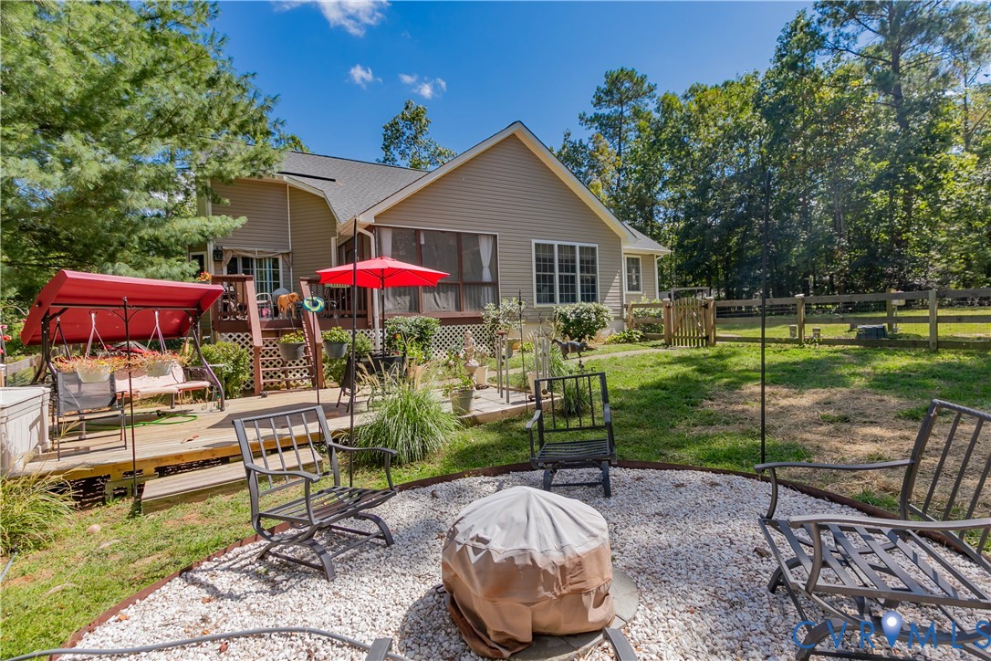 401 Loyalist Drive Ruther Glen, VA 22546 - Photo 6 of 44 a view of house with a yard and patio