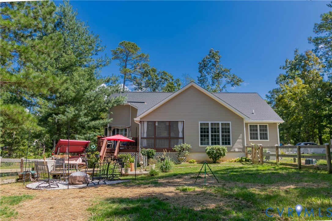 401 Loyalist Drive Ruther Glen, VA 22546 - Photo 10 of 44 a front view of a house with a yard