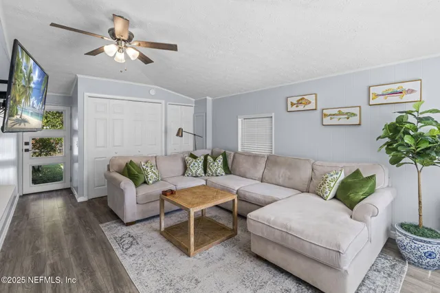 a living room with furniture and a window