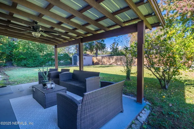 a view of a couches in backyard of house
