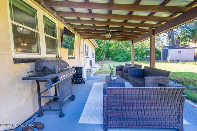 a living room with furniture and a window