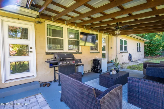 a living room with furniture and a large window