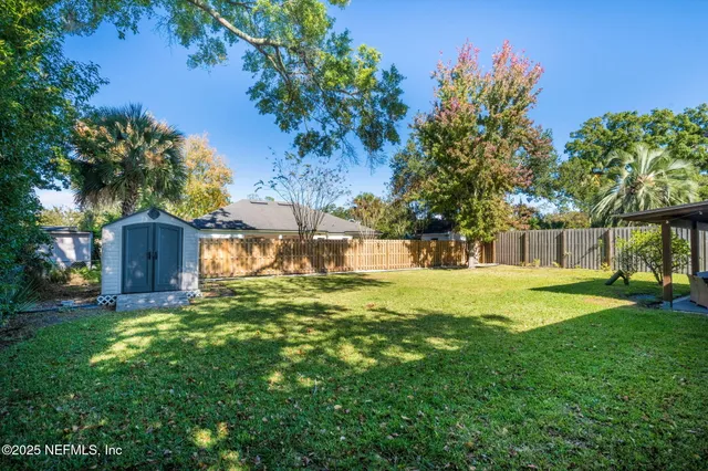a view of a back yard of the house