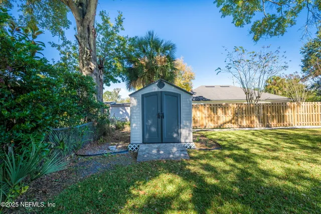 a front view of house with yard and seating area