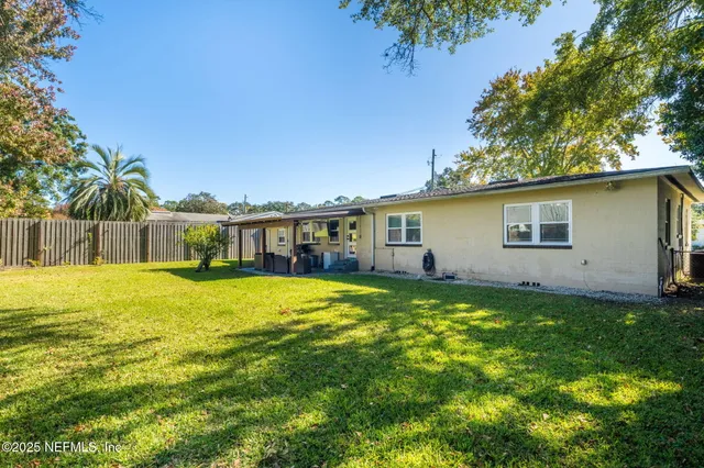 a front view of a house with a garden and porch