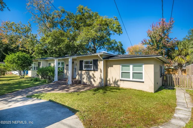 front view of a house with a yard