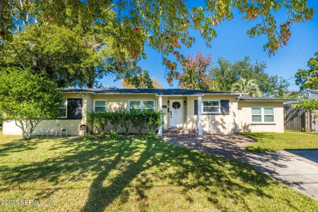 front view of a house with a big yard