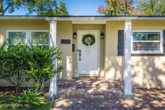a front view of a house with a porch