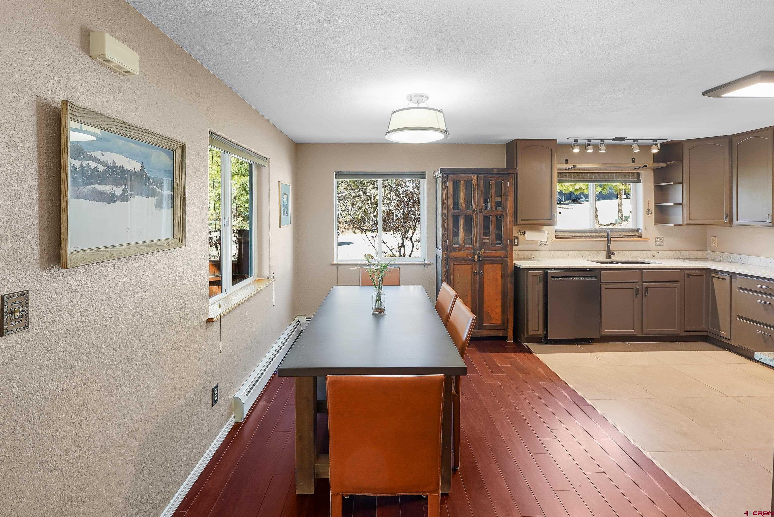 100 Westridge Road Durango, CO 81303 - Photo 11 of 39 a living room with stainless steel appliances granite countertop furniture wooden floor and window