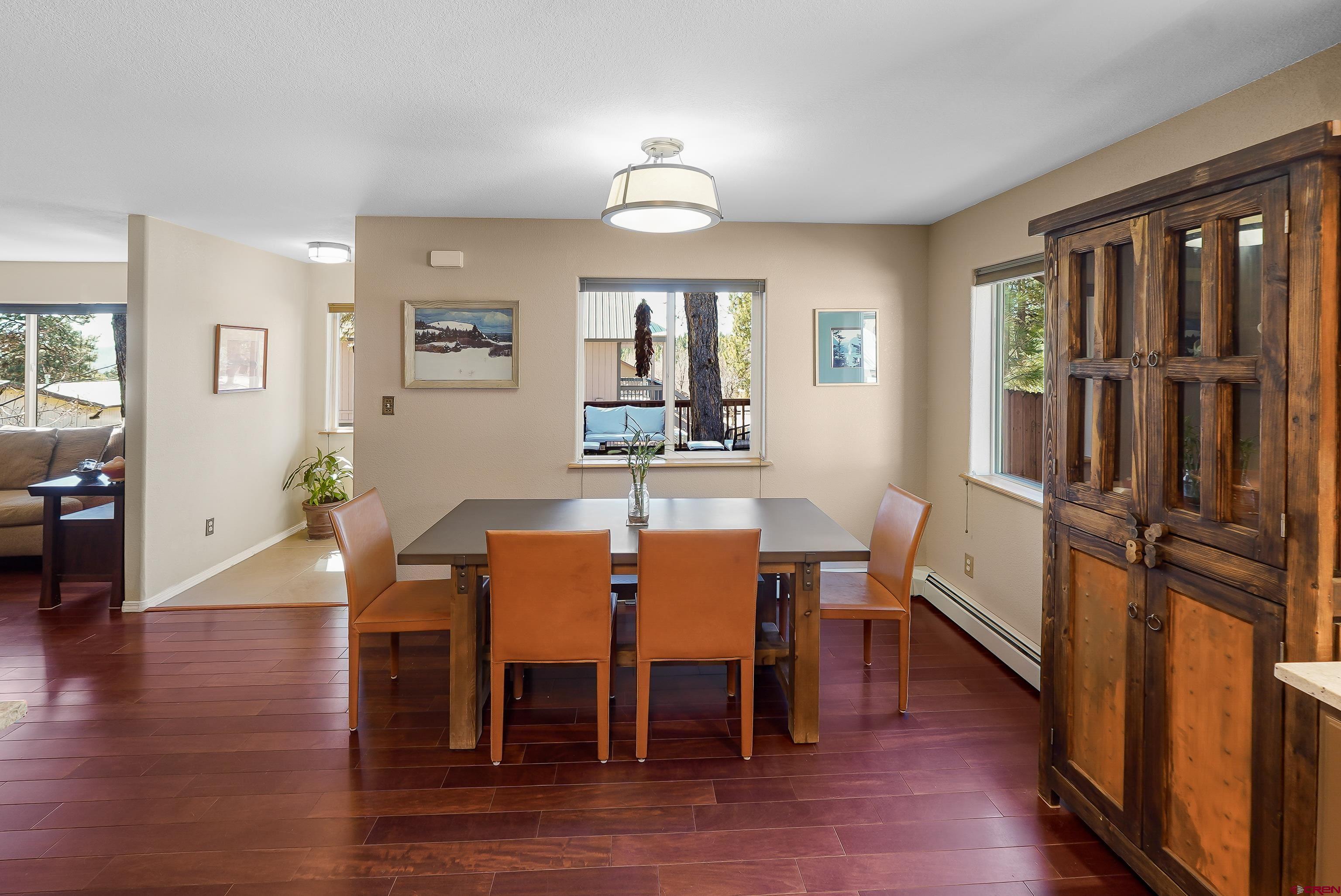 100 Westridge Road Durango, CO 81303 - Photo 12 of 39 a view of a dining room with furniture window and wooden floor