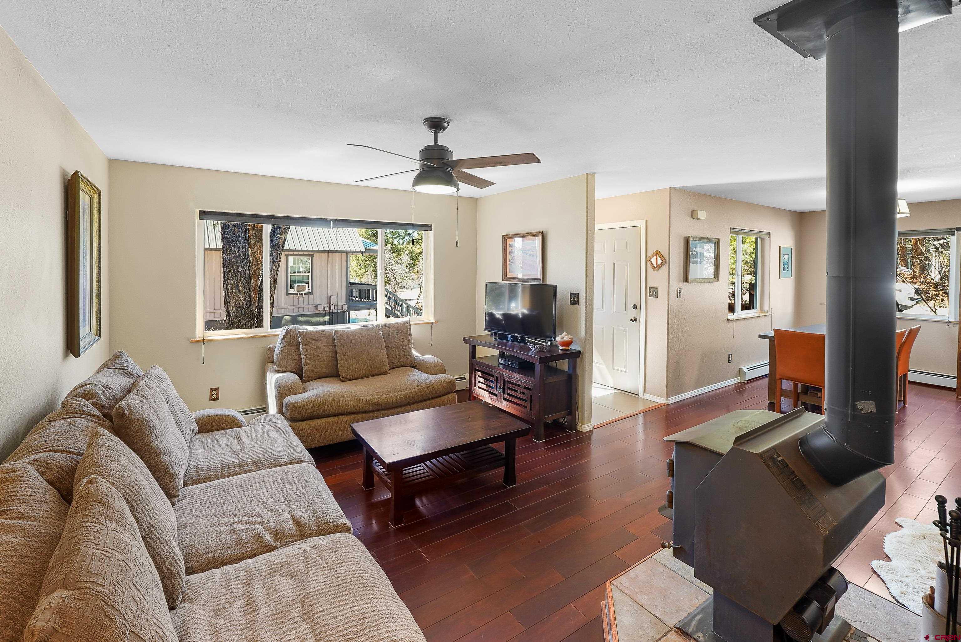 100 Westridge Road Durango, CO 81303 - Photo 13 of 39 a living room with furniture and a large window