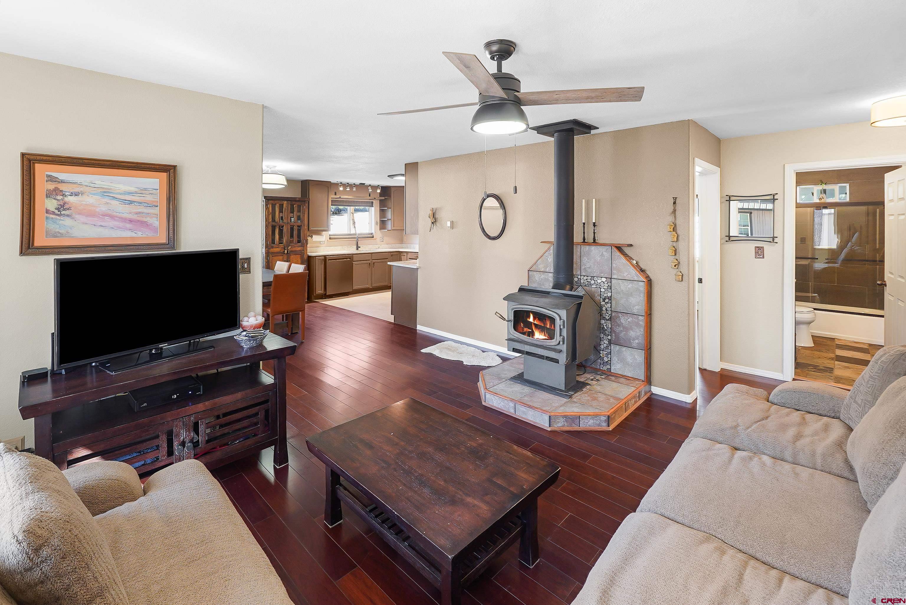 100 Westridge Road Durango, CO 81303 - Photo 14 of 39 a living room with furniture and a flat screen tv