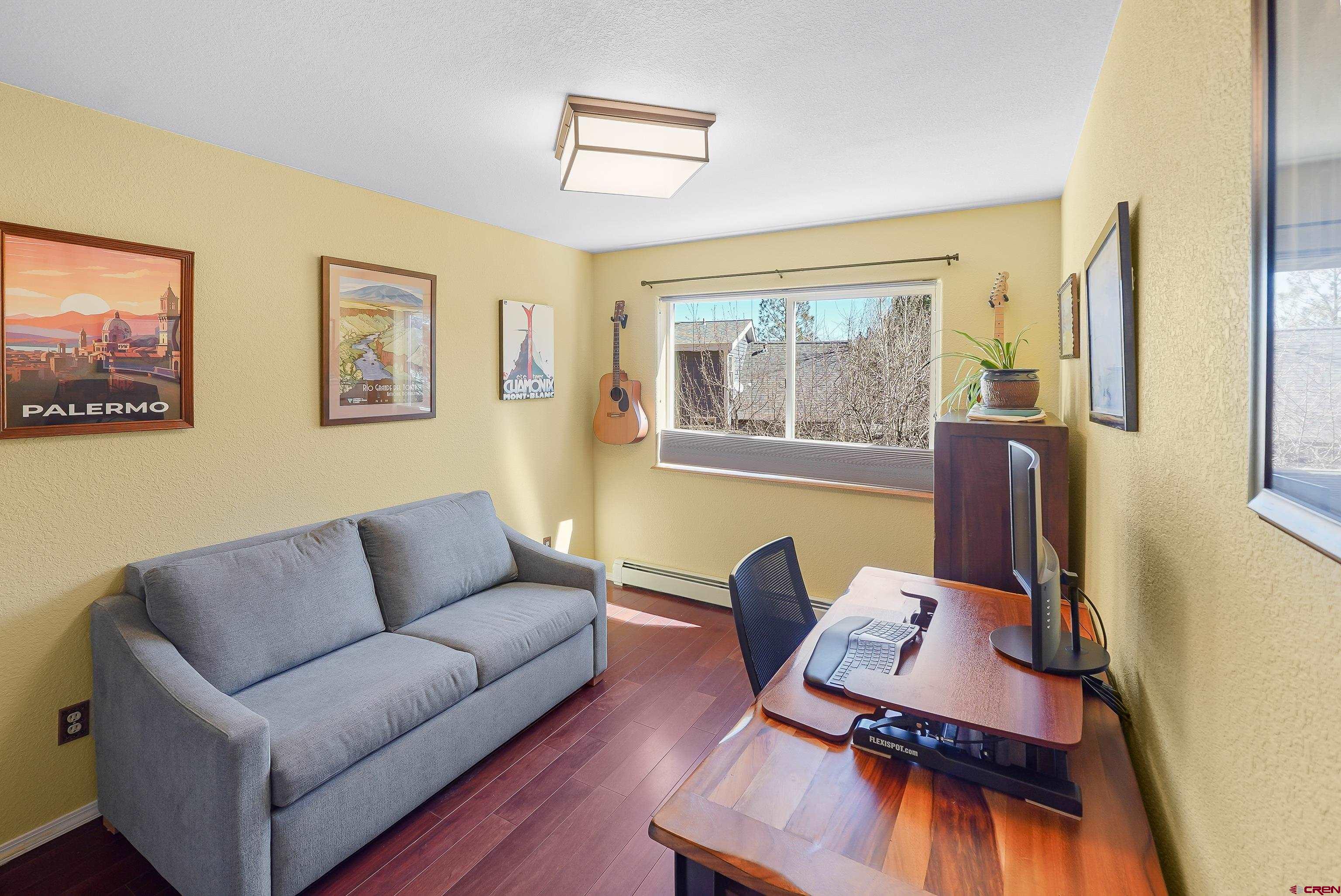 100 Westridge Road Durango, CO 81303 - Photo 17 of 39 a living room with furniture and a flat screen tv