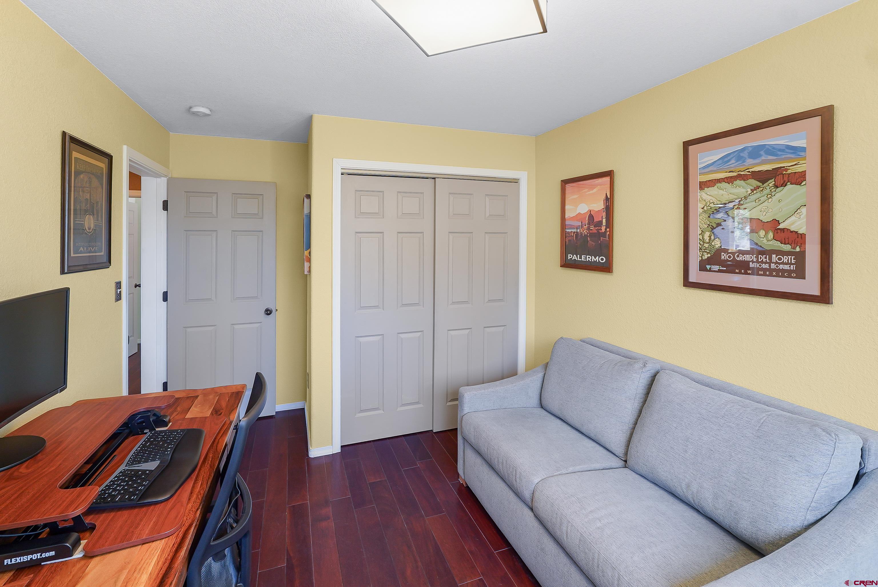 100 Westridge Road Durango, CO 81303 - Photo 18 of 39 a living room with furniture and a flat screen tv