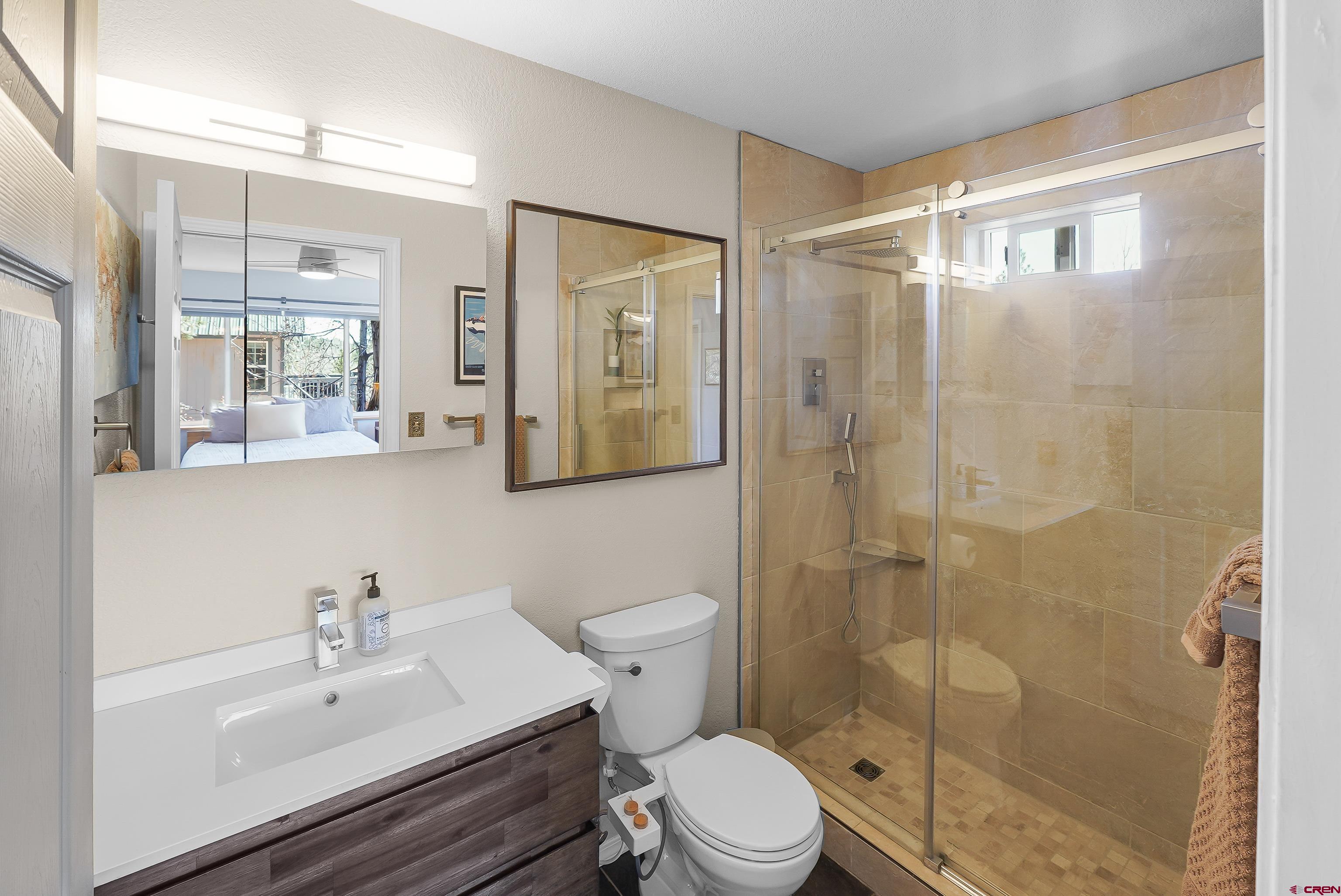 100 Westridge Road Durango, CO 81303 - Photo 19 of 39 a bathroom with a sink a toilet and shower