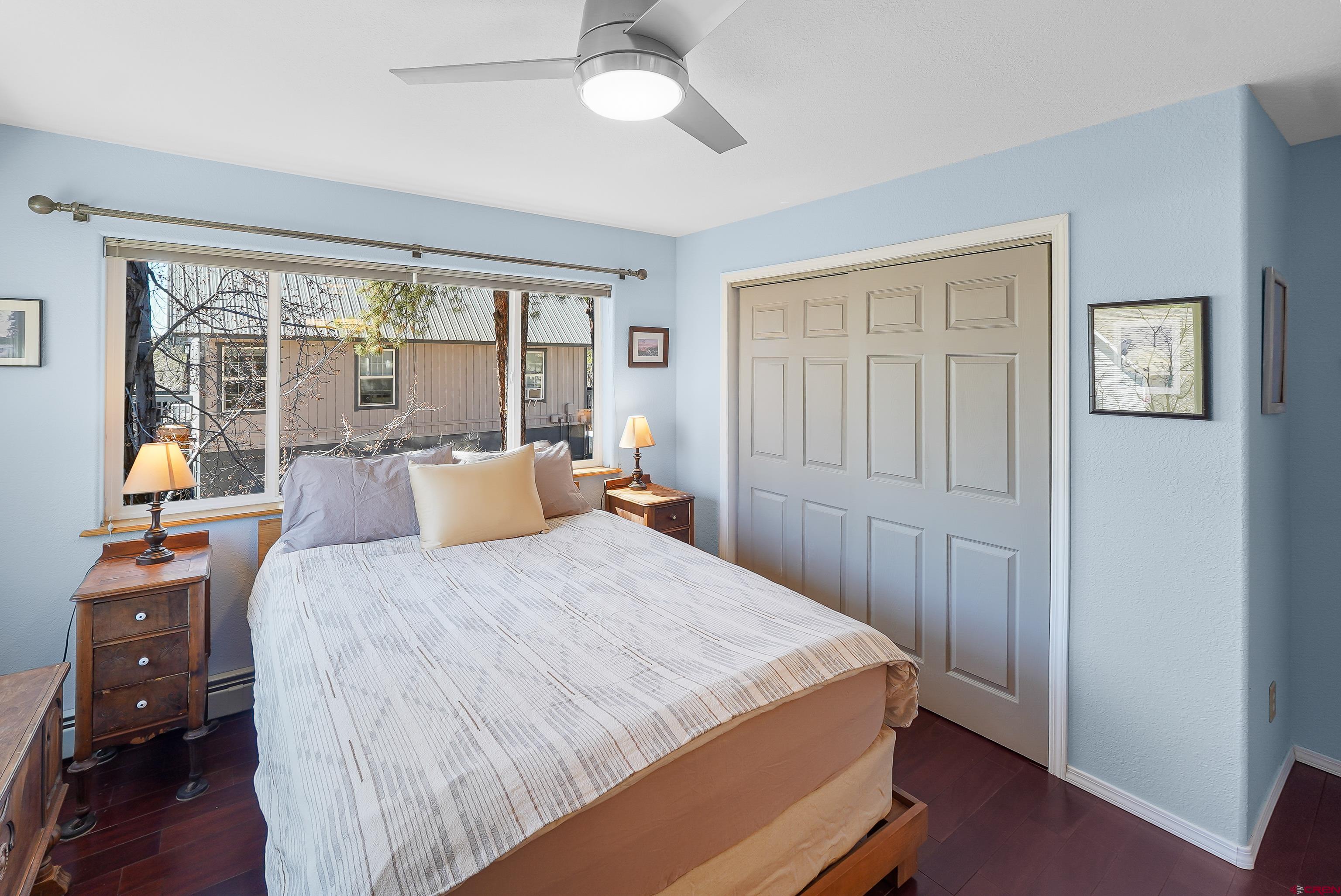 100 Westridge Road Durango, CO 81303 - Photo 20 of 39 a bed sitting in a bedroom next to a window