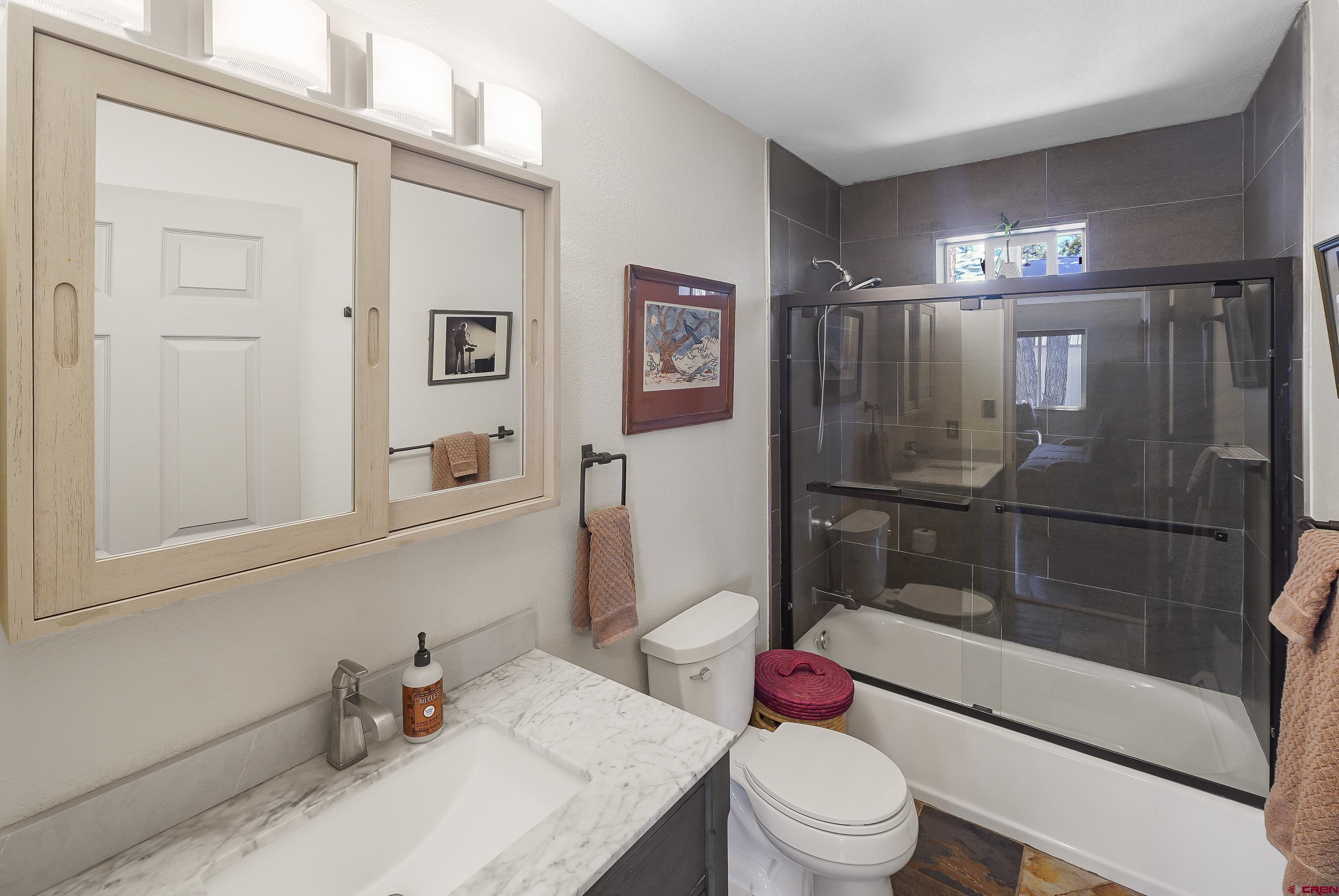 100 Westridge Road Durango, CO 81303 - Photo 23 of 39 a bathroom with a sink toilet and shower