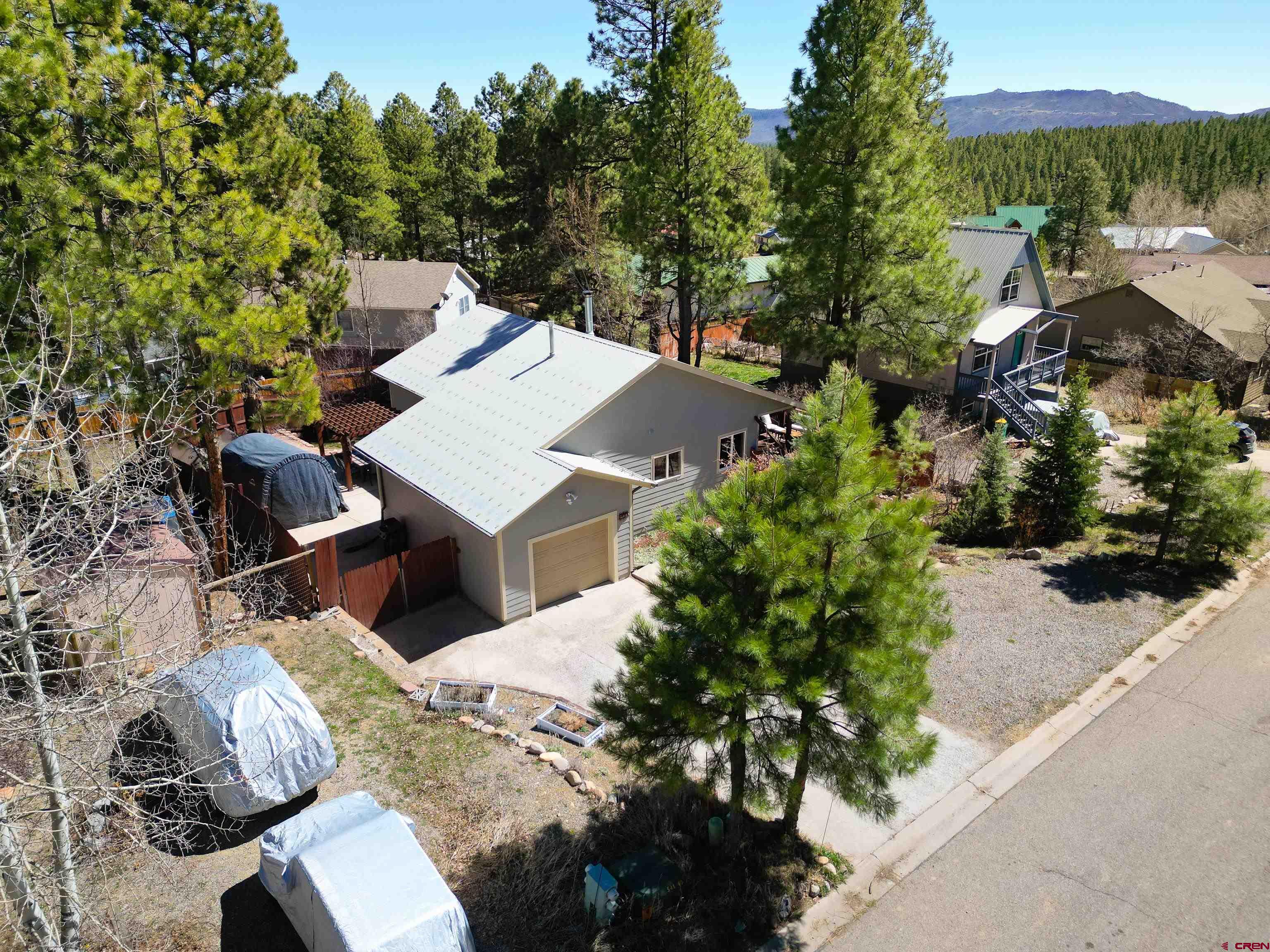 100 Westridge Road Durango, CO 81303 - Photo 3 of 39 an aerial view of a house with a yard and trees
