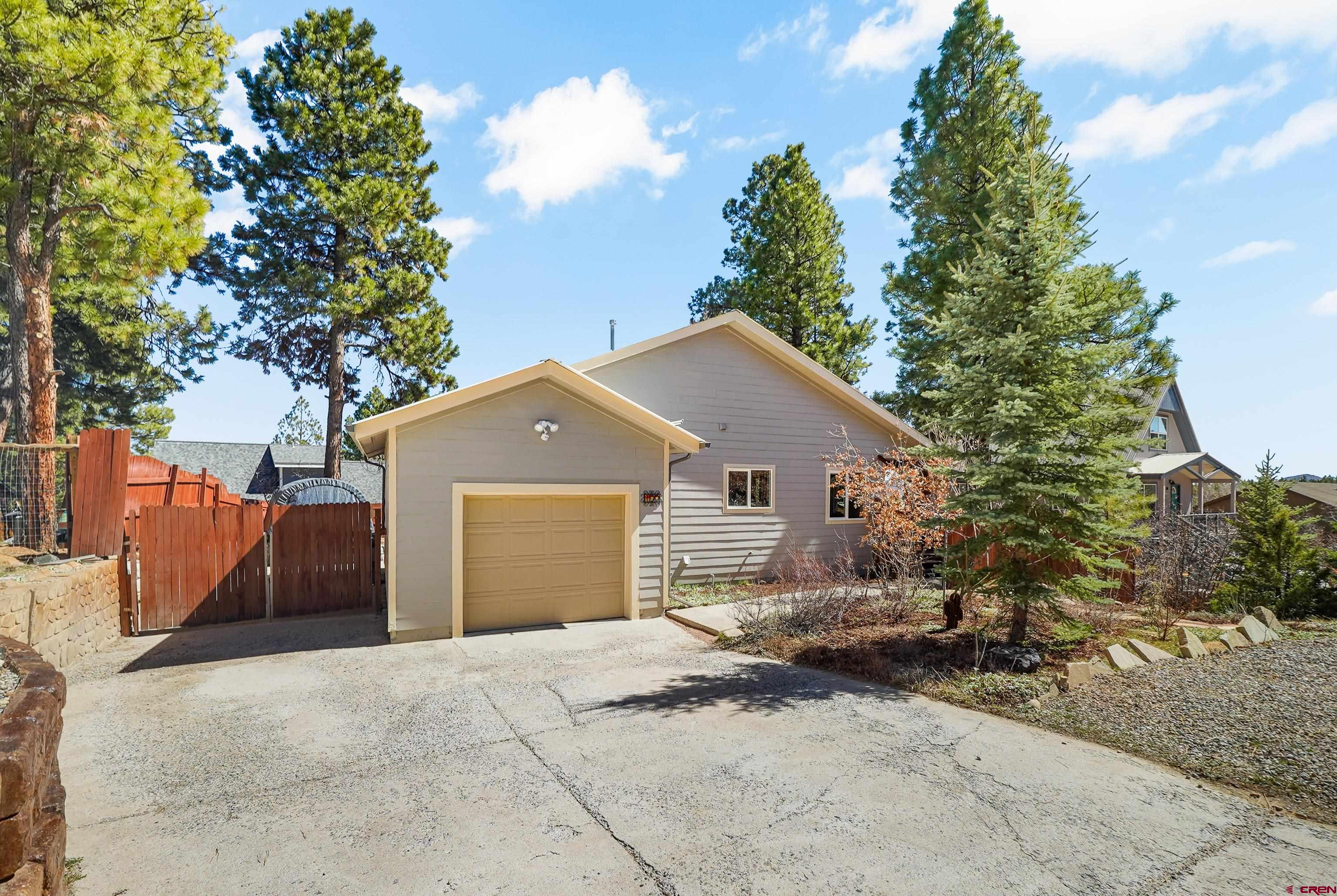 100 Westridge Road Durango, CO 81303 - Photo 37 of 39 a view of a house with a yard and large tree
