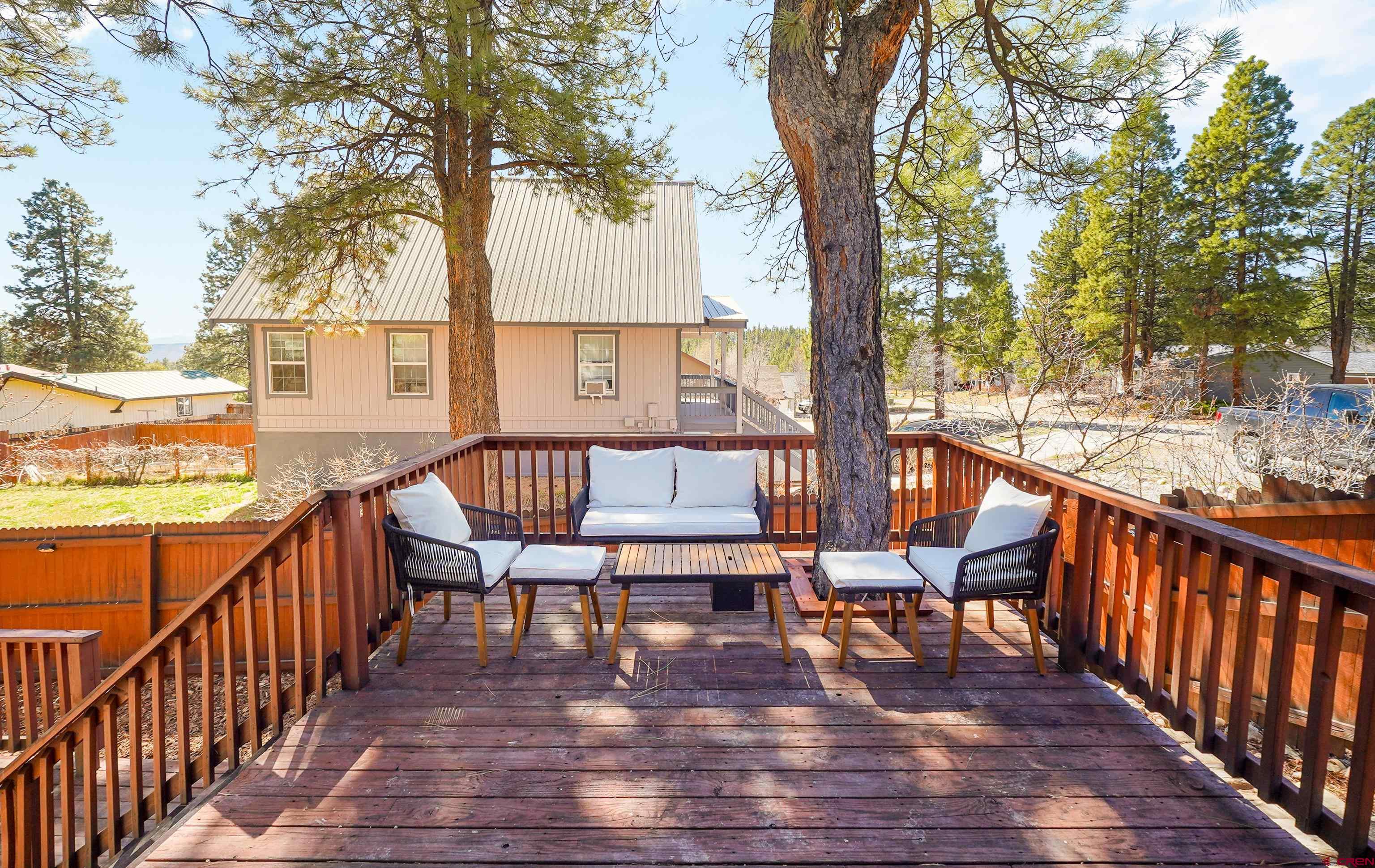 100 Westridge Road Durango, CO 81303 - Photo 4 of 39 a view of a chairs on wooden deck