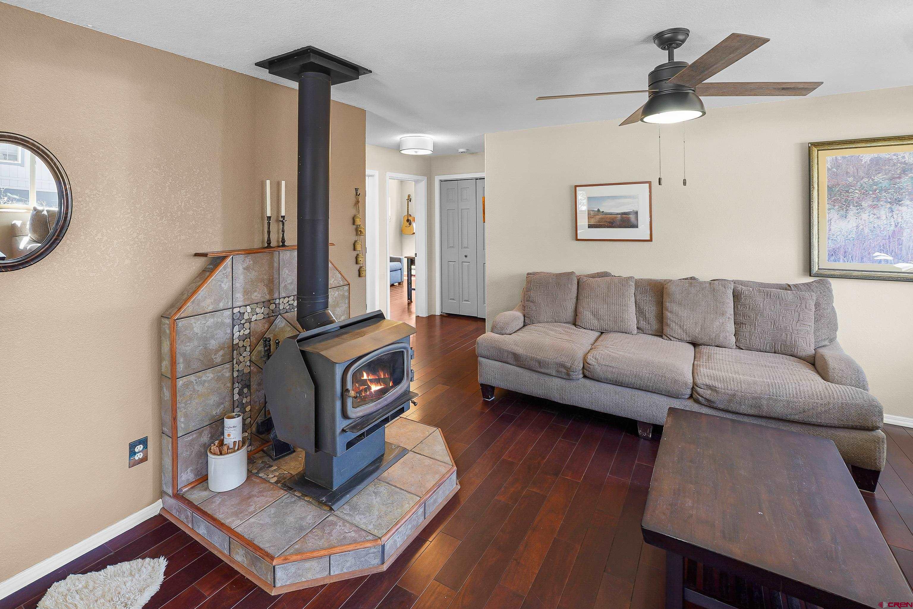 100 Westridge Road Durango, CO 81303 - Photo 5 of 39 a living room with furniture and a wooden floor
