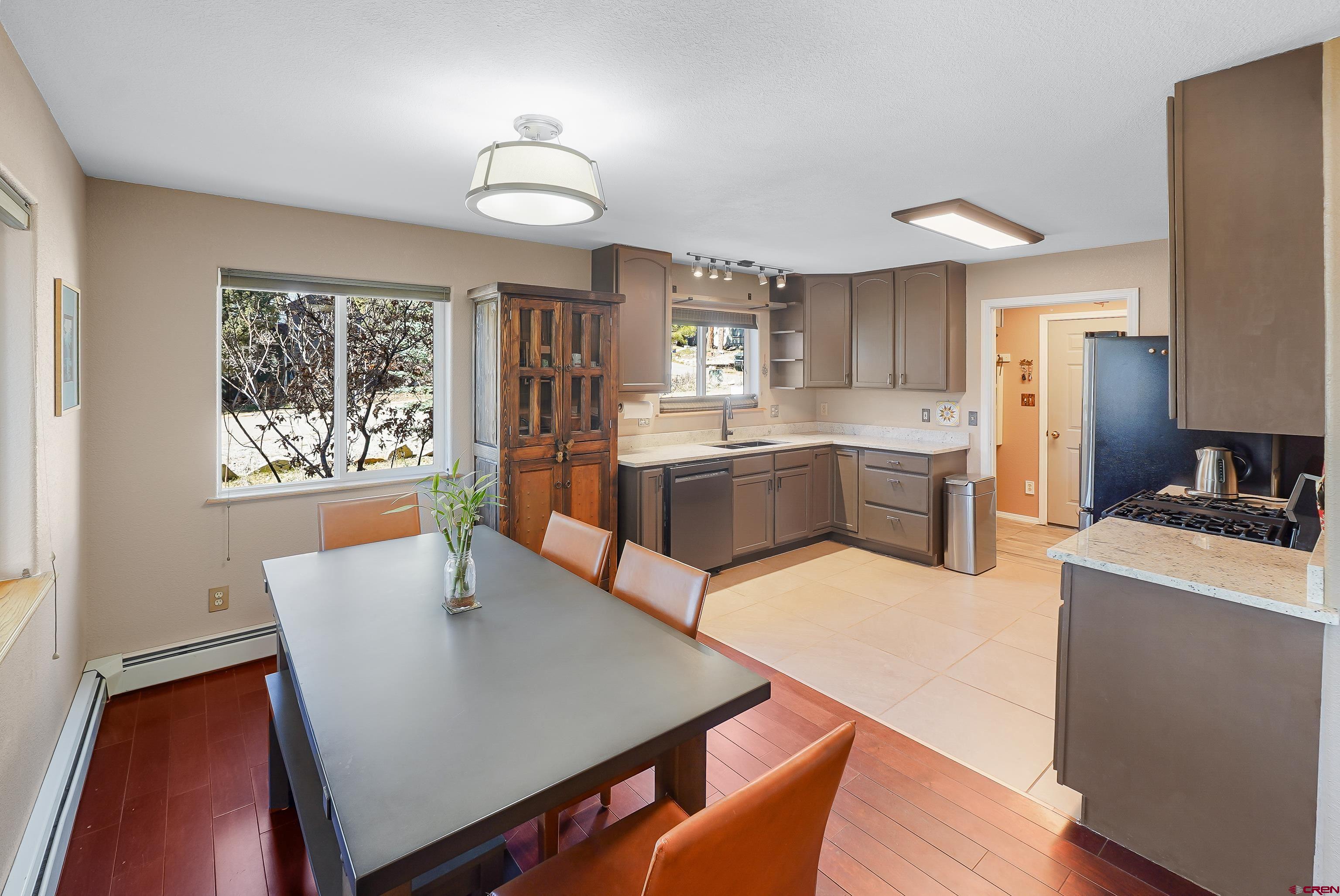 100 Westridge Road Durango, CO 81303 - Photo 7 of 39 a large kitchen with a table and chairs