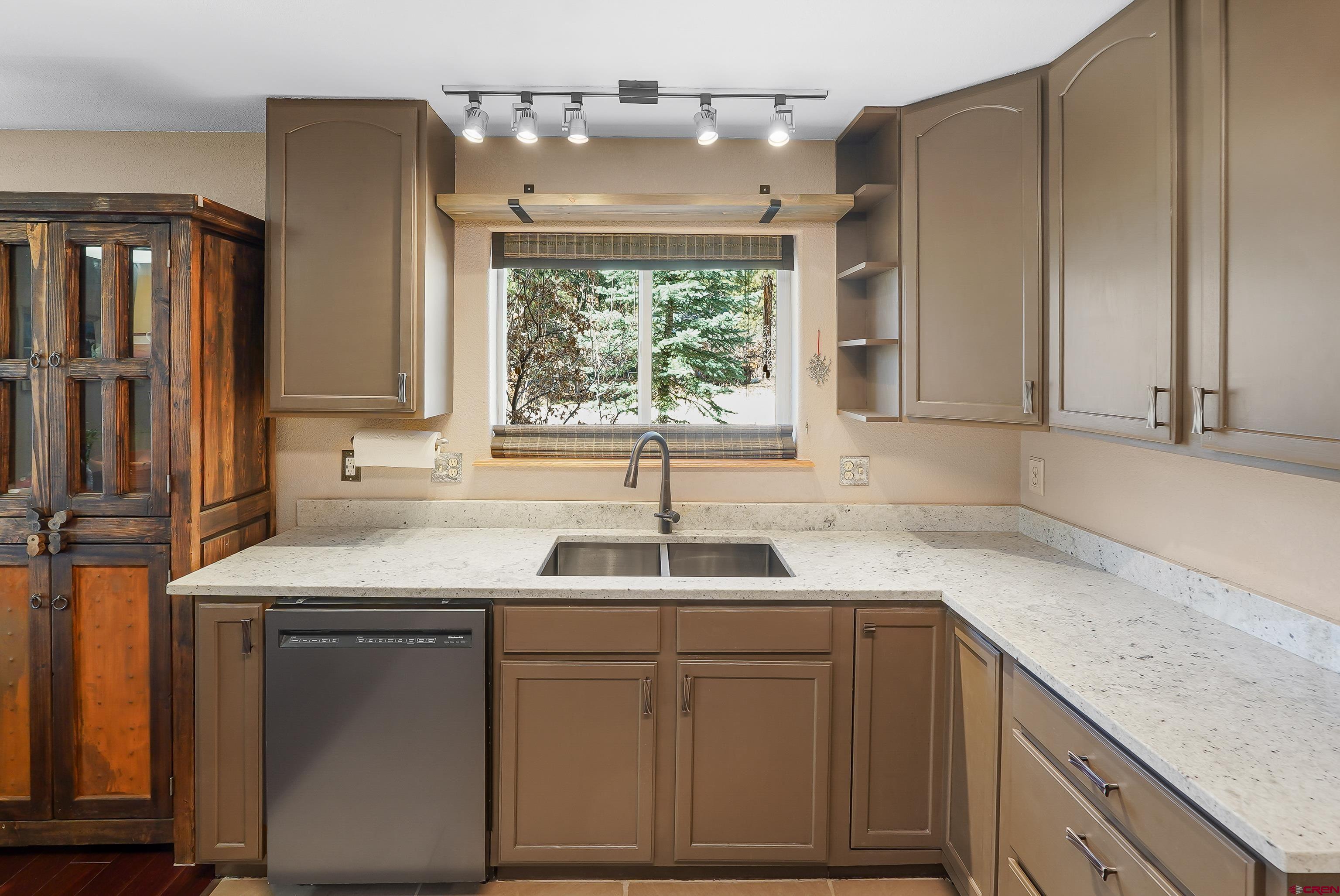 100 Westridge Road Durango, CO 81303 - Photo 9 of 39 a kitchen with a sink cabinets and window