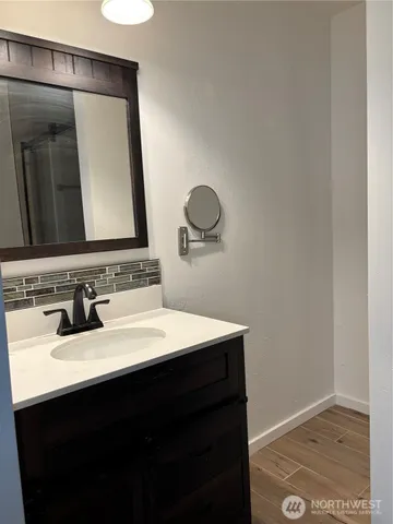 a bathroom with a sink and a mirror