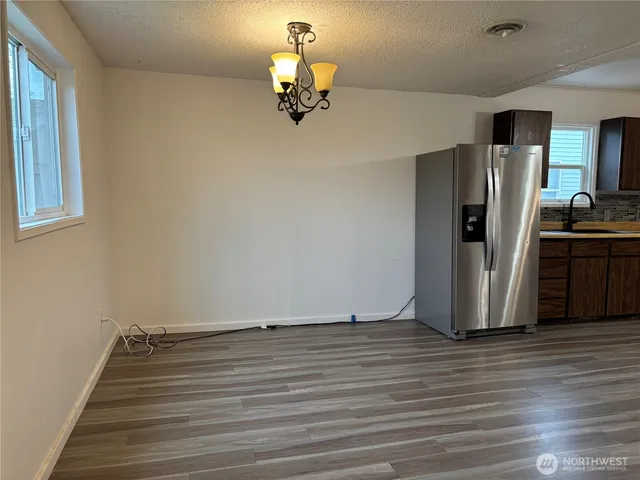 a view of a livingroom with wooden floor