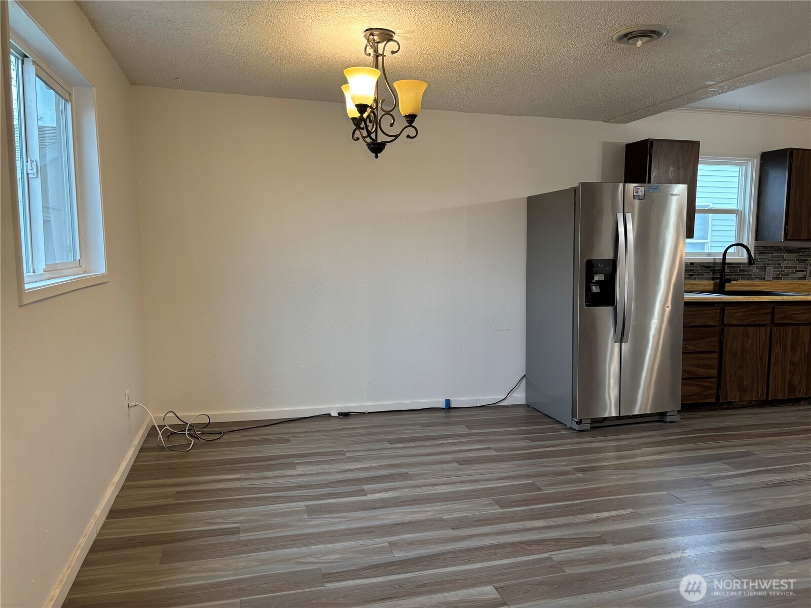 2207 West Spruce Street Moses Lake, WA 98837 - Photo 13 of 18 a view of a livingroom with wooden floor