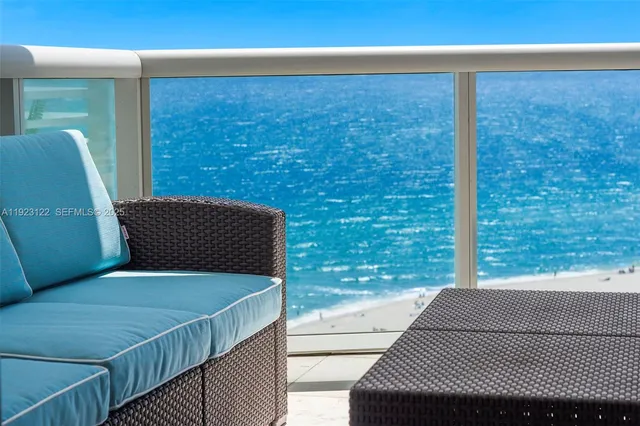 a balcony with wooden floor and outdoor space